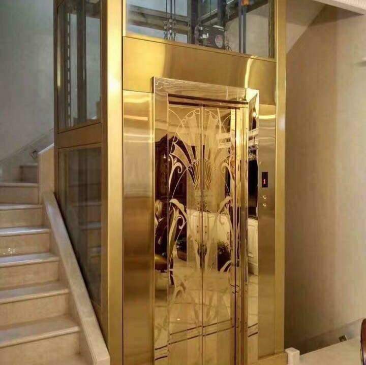 Mẫu Thang Máy Inox Hoa Văn Vàng